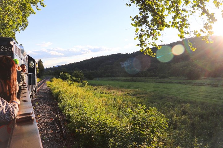 a person riding a bike down a dirt road