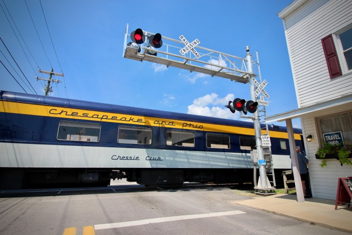 a train is parked on the side of a road