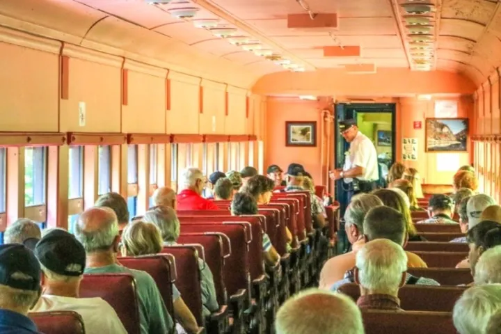 a group of people in Standard Coach