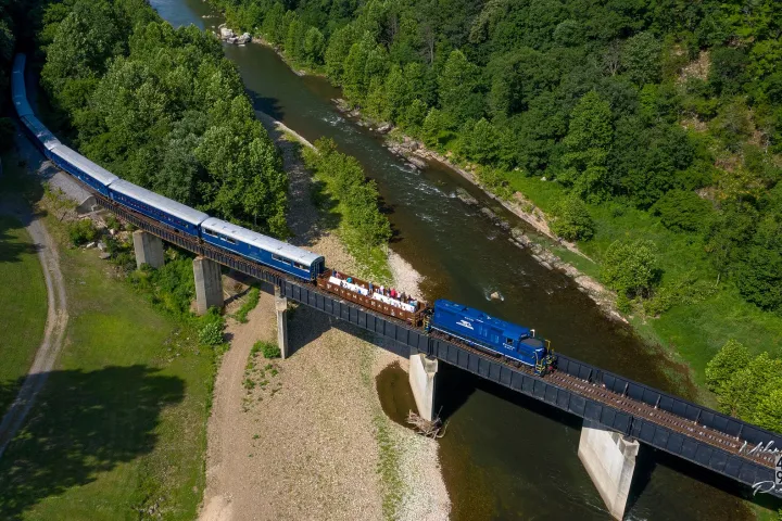 a train crossing a bridge over a river