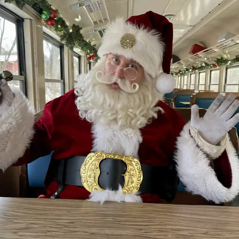 Santa Clause holding his bells on the Potomac Eagle train