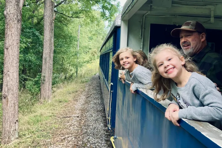 a man and a woman standing on a bridge
