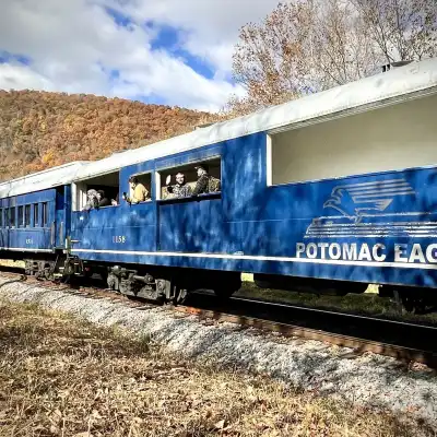 a blue train going down the track