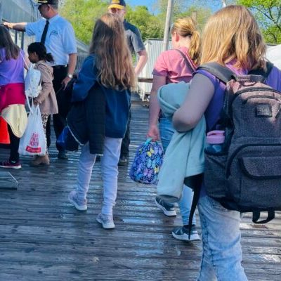 Educationa group on the platform boarding the train
