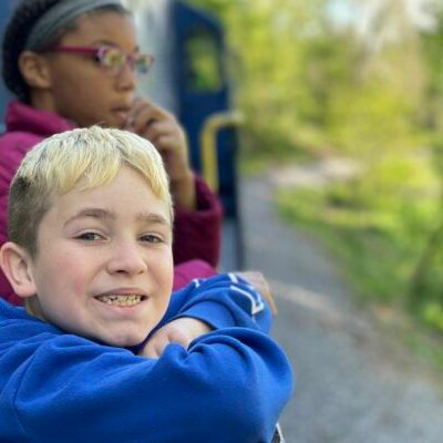 a young boy smiling for the camera