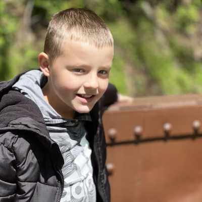 a little boy looking at the camera