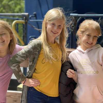 Three young girls on the gondola smiling