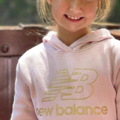 a little girl smiling at the camera