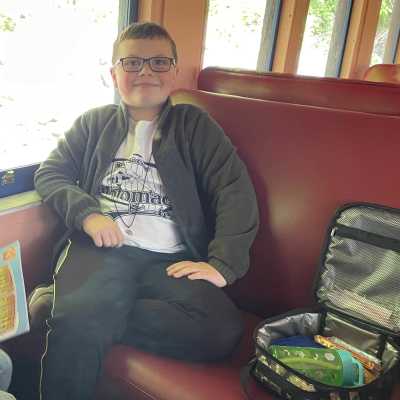 Boy about to enjoy his lunch during an educational group field trip