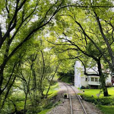 train tracks by an old house
