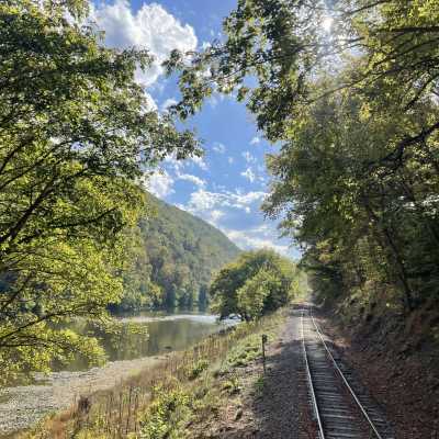 a train traveling down tracks by mile marker 27