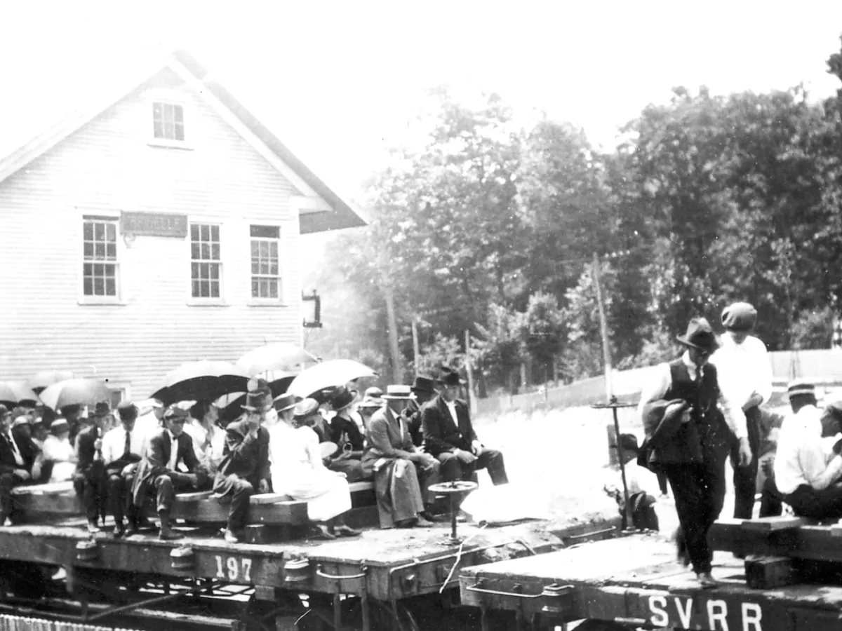 a group of people standing in front of a building