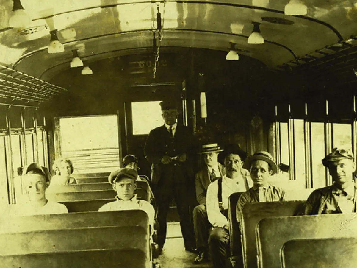 a group of people sitting at a train station