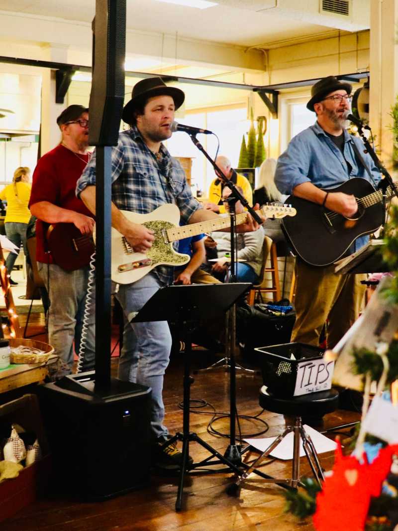 a group of people standing around a table