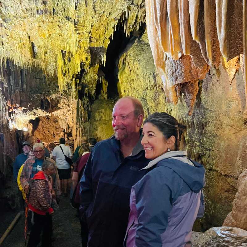 a group of people standing around each other