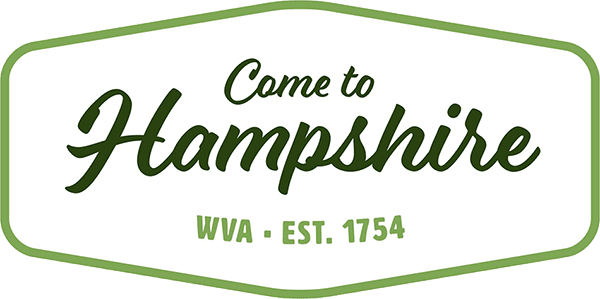 Green-bordered sign: 'Come to Hampshire WVA - EST. 1754'.